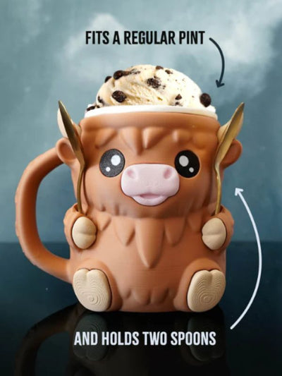 Ice cream pint insulator in the shape of a fluffy Highland cow.