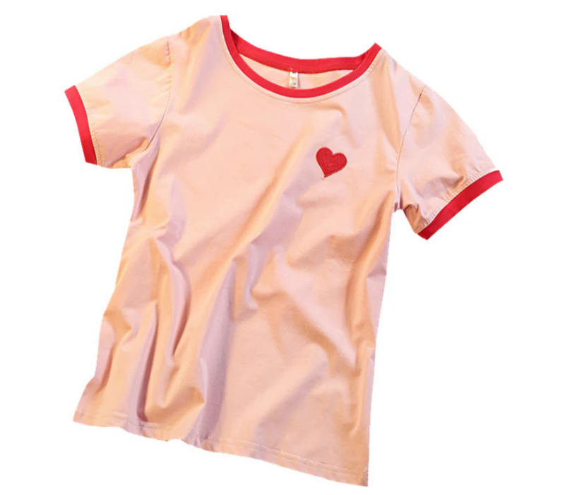 Sweet Love Tee in pink, featuring a cute design with a small red heart, perfect for a soft and charming look.