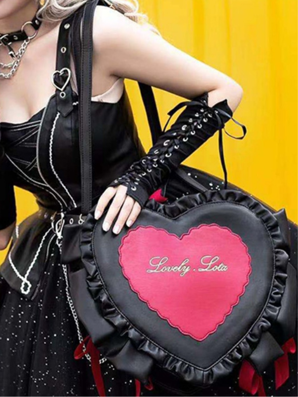 SweetheartCandyBag black heart-shaped bag with delicate ruffles around, perfect for a sweet and charming touch.