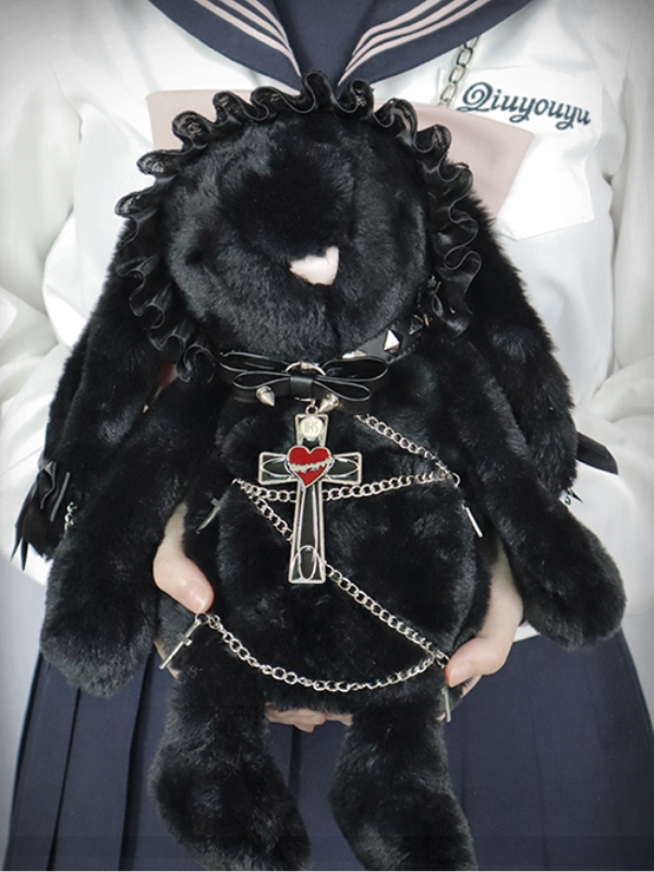Bunny bag with large ears, leather collar, cross pendant, and chains wrapped around the bunny, highlighting a bold gothic look.