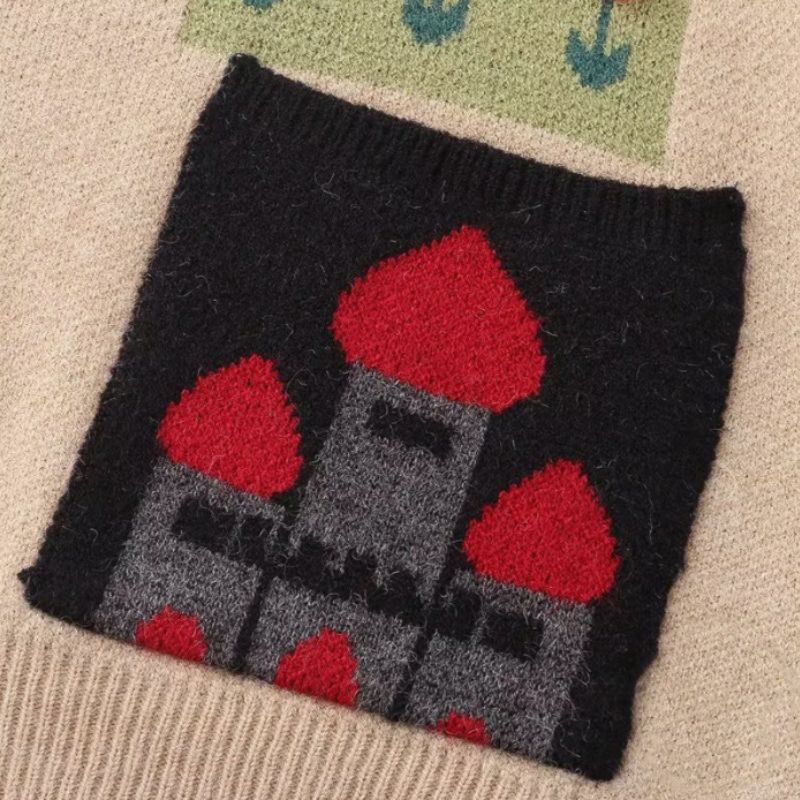 Cartoon knit cardigan with playful designs and front illustrated pockets.