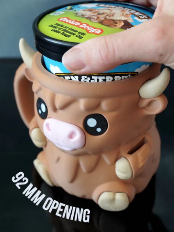 Kawaii Highland cow pint sleeve keeping ice cream cold and hands warm.