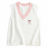 White vest with a cute embroidered peach on the top right, adding a sweet and charming touch.