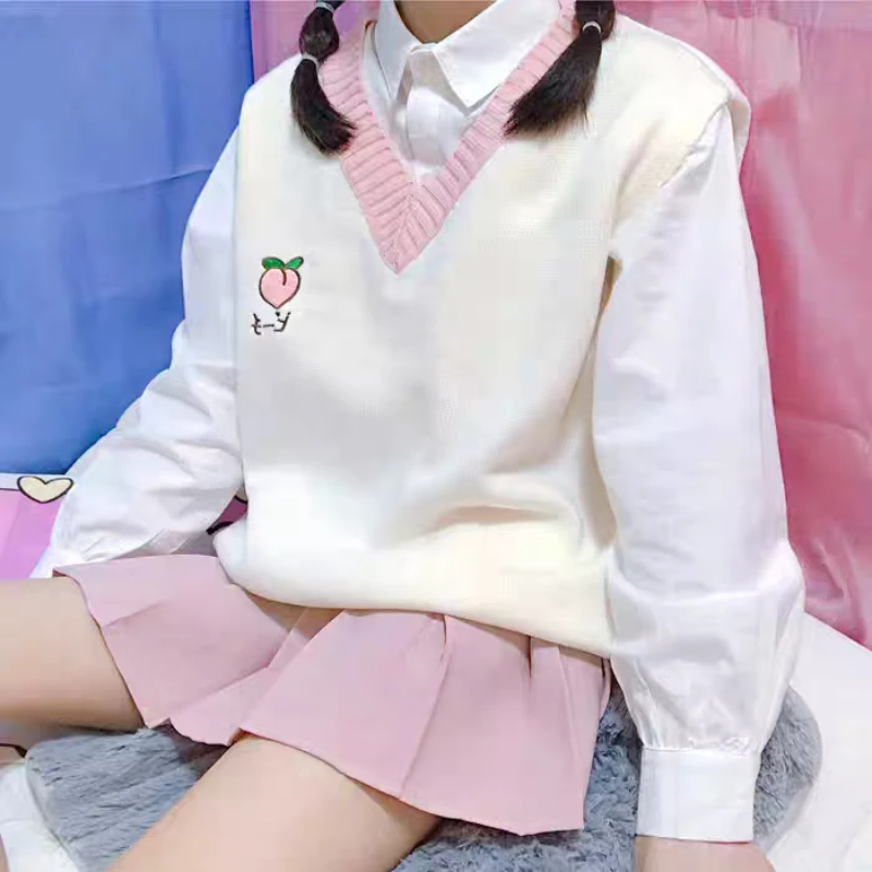 Kawaii Embroidery Fruits Knitted Vest in white with a V-neck and a small embroidered peach on the top right for a cute touch.