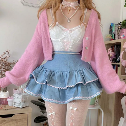 Model wearing a kawaii high waist denim skirt in pastel outfit, front view