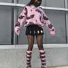 Kawaii Pink Knit Sweater with Bats and Hearts, in pastel goth style, pairs perfectly with a cute kawaii or gothic skirt for a stylish, edgy look.