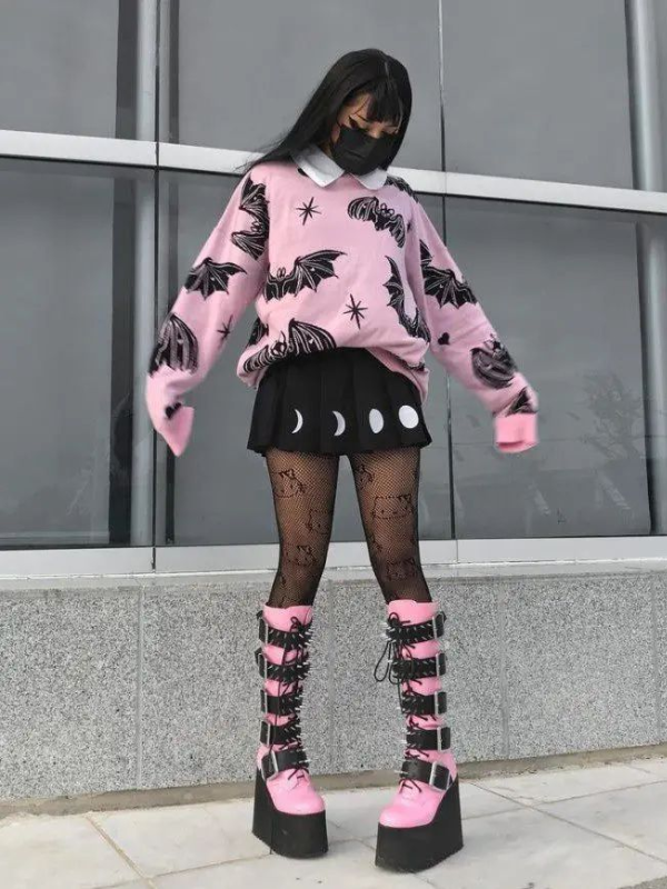 Kawaii Pink Knit Sweater with Bats and Hearts, in pastel goth style, pairs perfectly with a cute kawaii or gothic skirt for a stylish, edgy look.