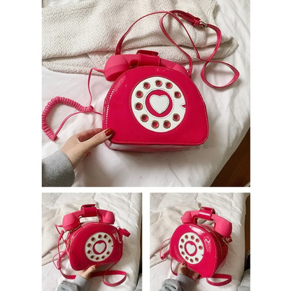 Various angles of the red phone-shaped bag, showcasing the retro design, zipper closure, adjustable strap, and 3.5mm connection.