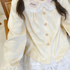 Kawaii Teddy Bear Blouse with regular sleeves and lace details at the cuffs, adding a cute and elegant touch to the playful teddy bear design.