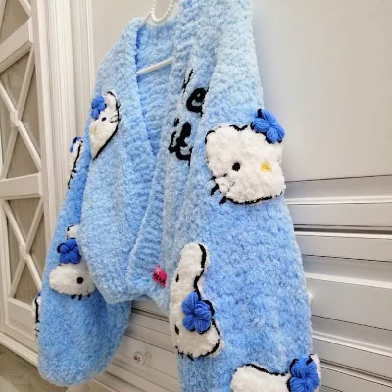 Cozy pastel blue cardigan with cute cat details