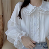 Lace Blouse with Peter Pan Collar, featuring puff sleeves, small round white buttons on the front, and a loose fit for an elegant style.