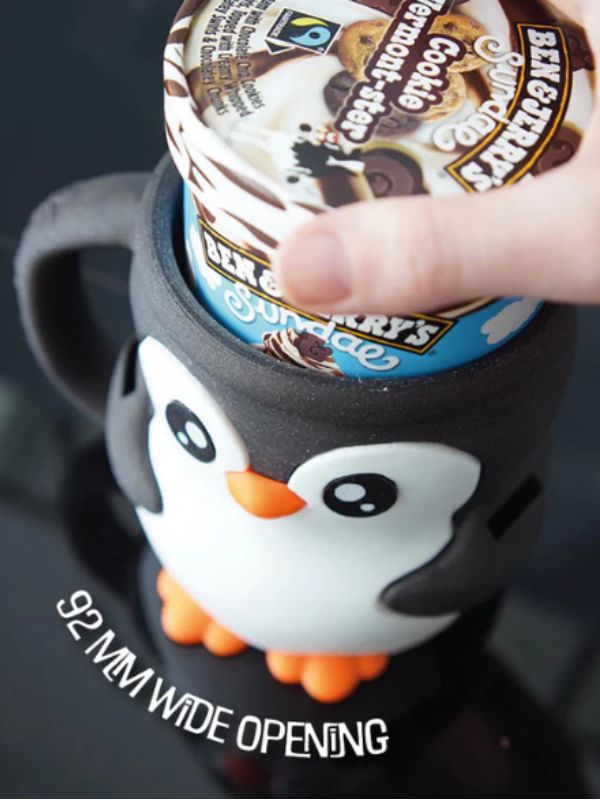 Cute penguin pint holder keeping ice cream cold and hands warm.