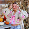 Romantic beige cardigan with rose accents