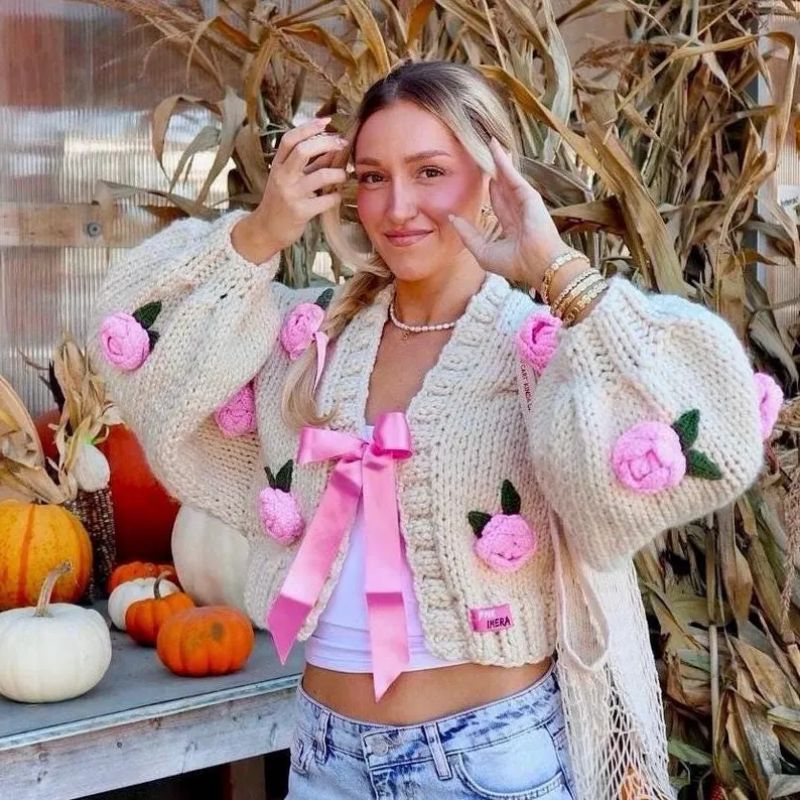 Romantic beige cardigan with rose accents
