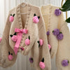 Short thick knit beige cardigan with hand-knitted roses