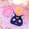 Cup mat inspired by Sailor Moon, featuring a cute design with soft pink and blue tones, and details of stars and moons. The mat showcases a delicate and charming silhouette of Sailor Moon.